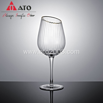 Gold rimmed red wine glasses